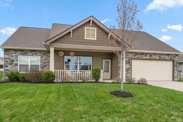 view of front of house featuring a garage, covered porch, a front yard, stone siding, and a shingled roof