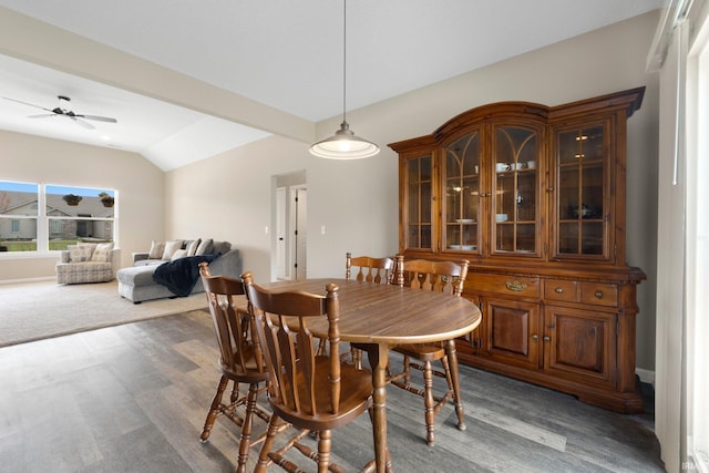 dining room featuring light wood-type flooring, ceiling fan, and lofted ceiling