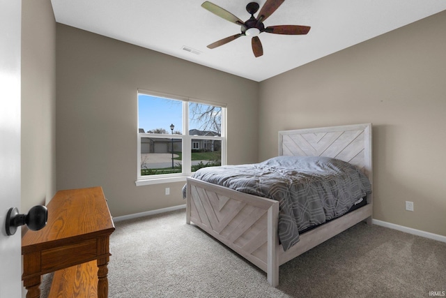bedroom featuring a ceiling fan, baseboards, carpet, and visible vents