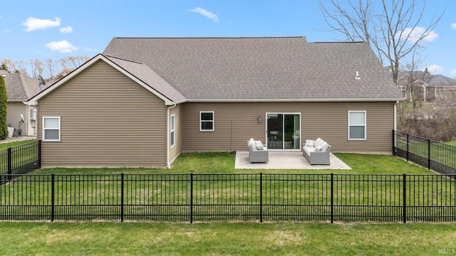 back of house with a patio, a yard, and a fenced backyard