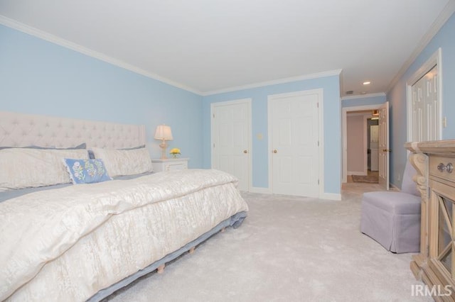 carpeted bedroom with crown molding, baseboards, and recessed lighting