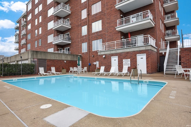 view of swimming pool featuring a patio