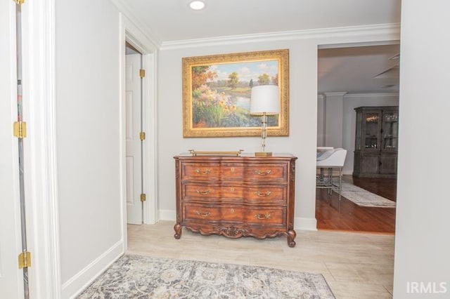 corridor featuring crown molding, baseboards, and recessed lighting