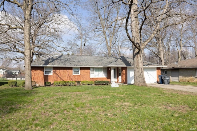 ranch-style home with a garage, a front yard, brick siding, and driveway