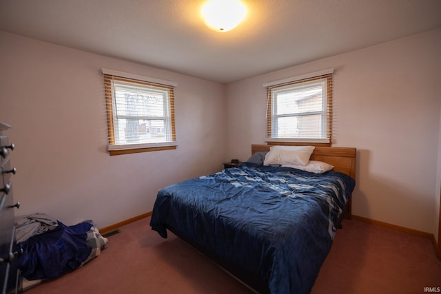 carpeted bedroom with baseboards