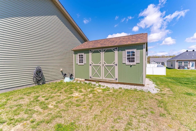 view of shed with fence