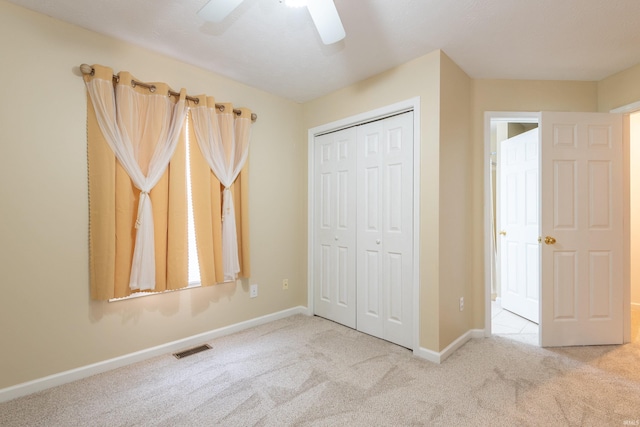 unfurnished bedroom featuring visible vents, a closet, baseboards, and carpet floors