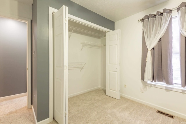 closet featuring visible vents
