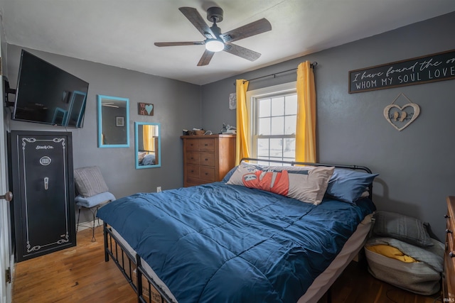 bedroom featuring ceiling fan and wood finished floors