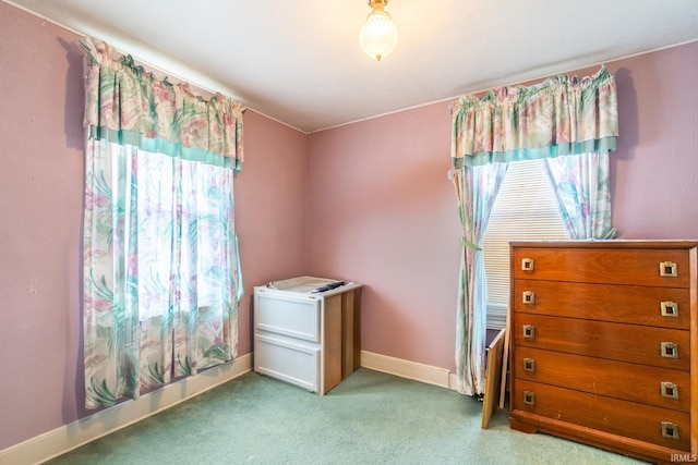 bedroom with baseboards and carpet flooring