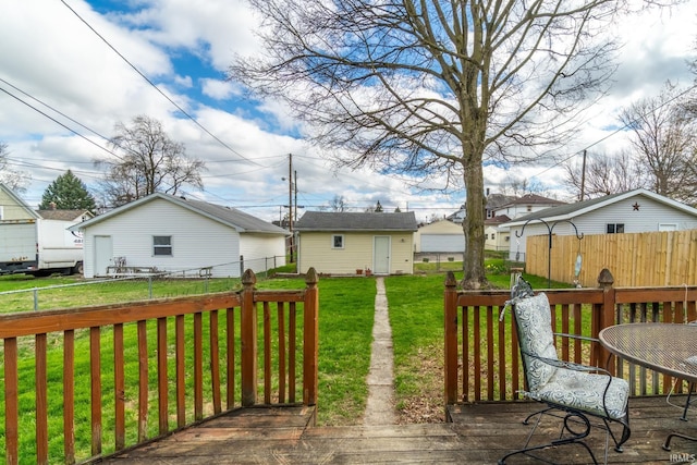 wooden deck with fence private yard and a lawn