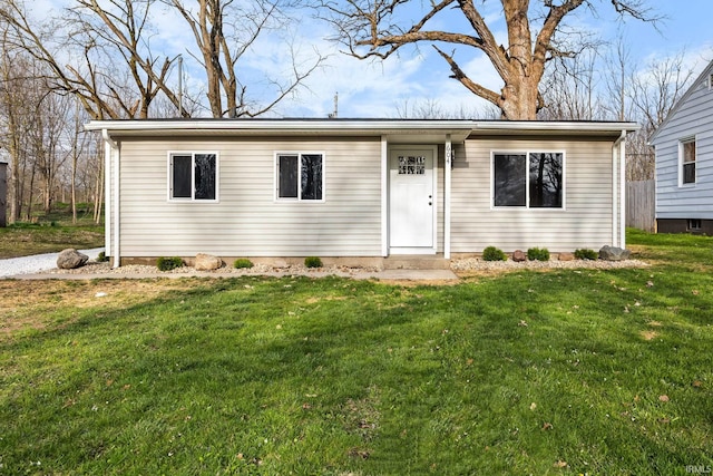ranch-style house featuring a front yard