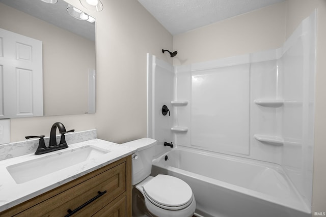full bath featuring toilet, vanity, shower / bath combination, and a textured ceiling