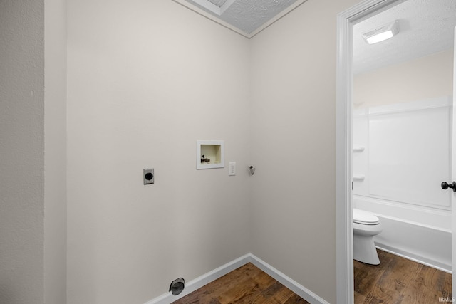 clothes washing area with laundry area, wood finished floors, hookup for an electric dryer, and washer hookup