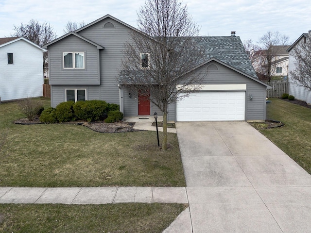 view of front of home with concrete driveway, a front yard, and an attached garage