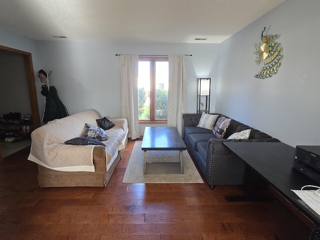 living room with visible vents and wood finished floors
