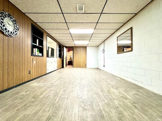 2119 Windwood Dr, Bedford, IN 47421 - empty room featuring visible vents, wood finished floors, and wood walls