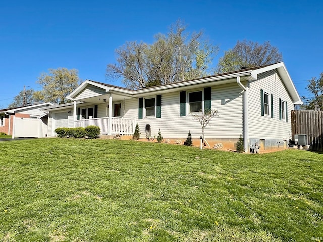 2119 Windwood Dr, Bedford, IN 47421 - ranch-style home with covered porch, fence, a front lawn, and central AC