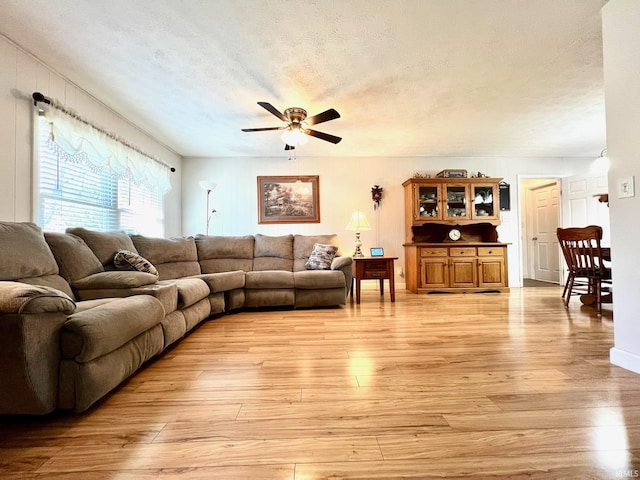 2119 Windwood Dr, Bedford, IN 47421 - living area featuring light wood-style flooring, a textured ceiling, and ceiling fan