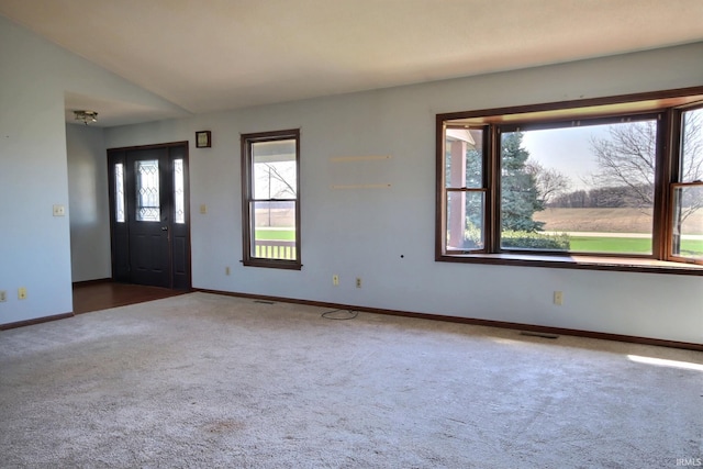 carpeted entryway with visible vents and baseboards