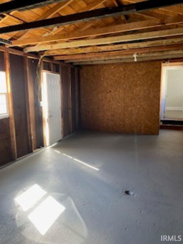 misc room with finished concrete floors