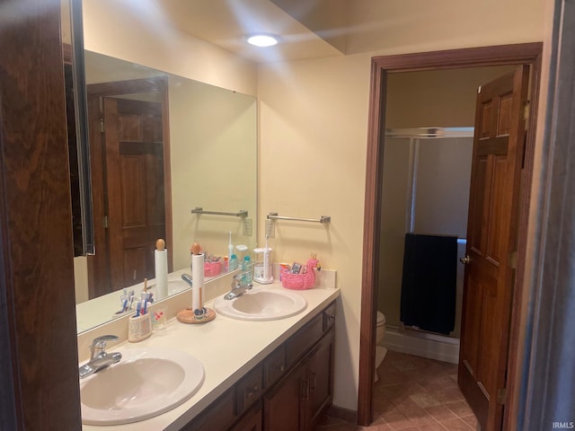 15516 Menominee Dr, Plymouth, IN 46563 - full bathroom with toilet, double vanity, a sink, and a stall shower