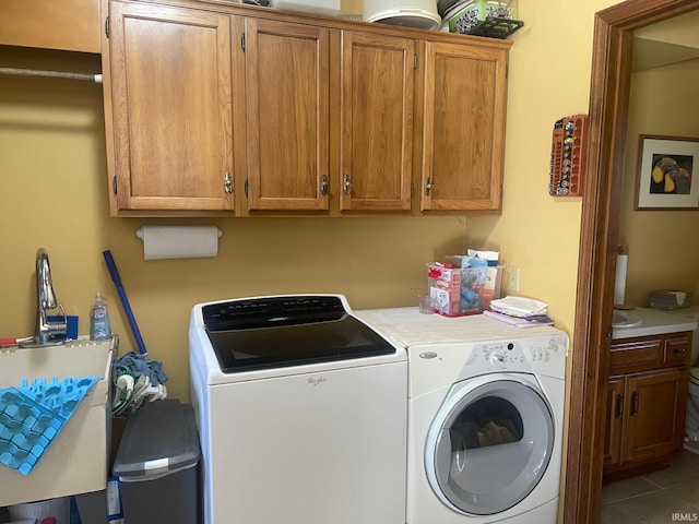 15516 Menominee Dr, Plymouth, IN 46563 - laundry area with washing machine and clothes dryer, tile patterned flooring, and cabinet space