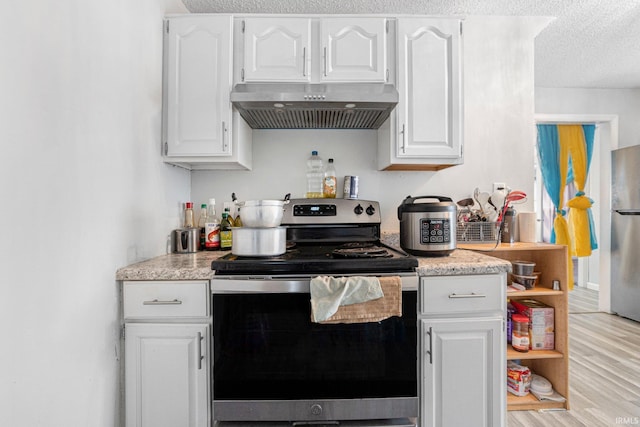 3930 Abbott St, Fort Wayne, IN 46806 - kitchen featuring a textured ceiling, white cabinets, appliances with stainless steel finishes, and under cabinet range hood