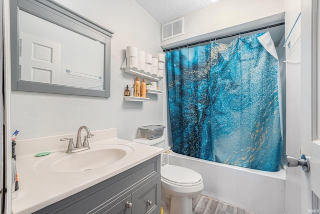 3930 Abbott St, Fort Wayne, IN 46806 - full bathroom featuring visible vents, toilet, shower / tub combo with curtain, vanity, and wood finished floors