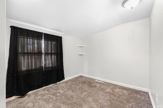 3930 Abbott St, Fort Wayne, IN 46806 - carpeted spare room with baseboards and a textured ceiling