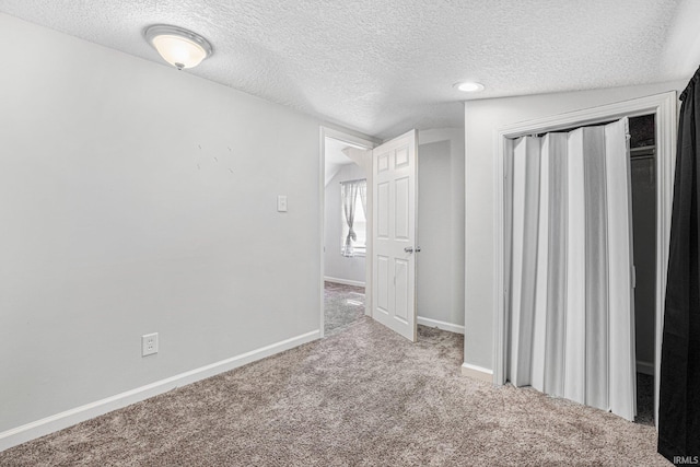 3930 Abbott St, Fort Wayne, IN 46806 - unfurnished bedroom with a textured ceiling, a closet, baseboards, and carpet