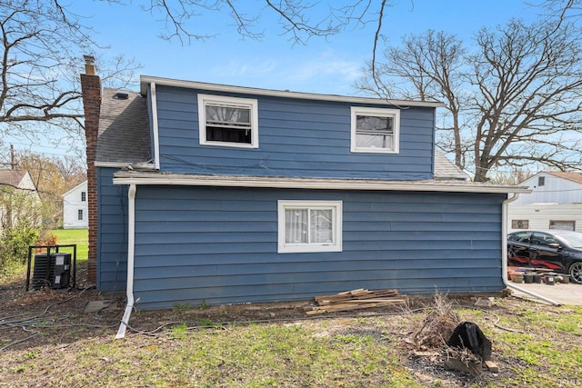 3930 Abbott St, Fort Wayne, IN 46806 - view of property exterior featuring a chimney and a shingled roof
