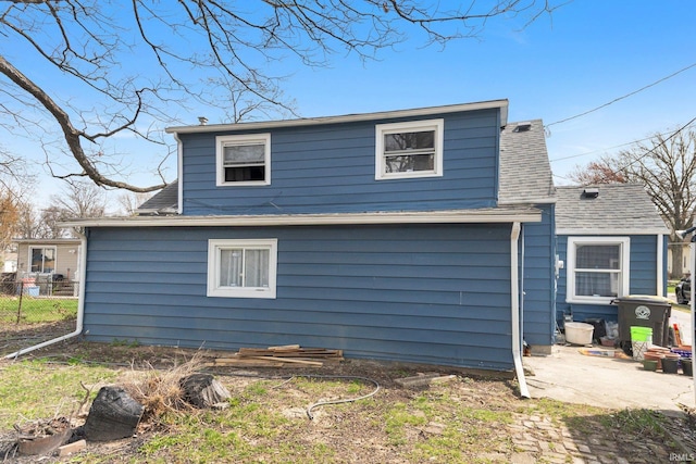 3930 Abbott St, Fort Wayne, IN 46806 - back of property featuring fence, a patio, and a shingled roof
