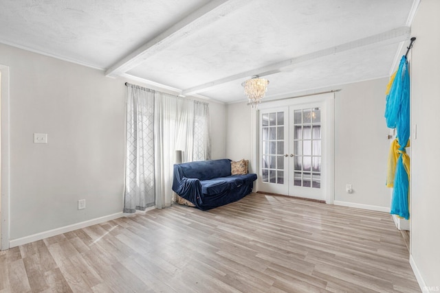3930 Abbott St, Fort Wayne, IN 46806 - sitting room with french doors, baseboards, beamed ceiling, and wood finished floors