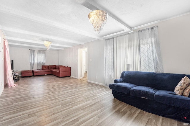 3930 Abbott St, Fort Wayne, IN 46806 - living room featuring light wood-style flooring, beamed ceiling, a notable chandelier, and baseboards