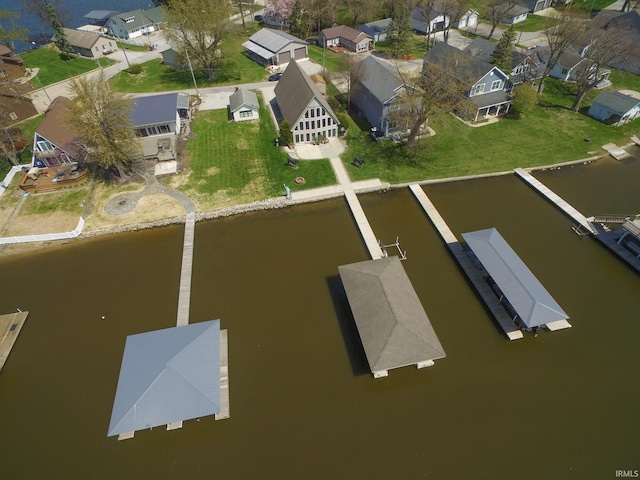 bird's eye view with a water view and a residential view