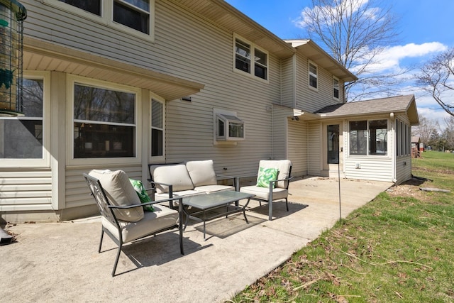 view of patio featuring an outdoor hangout area and a sunroom