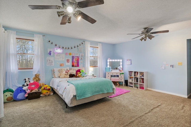 bedroom with carpet flooring, a textured ceiling, and ceiling fan
