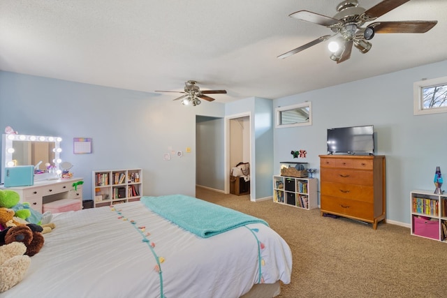bedroom featuring ceiling fan, carpet floors, and baseboards