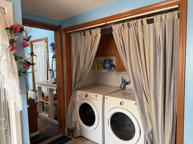 clothes washing area featuring independent washer and dryer and laundry area