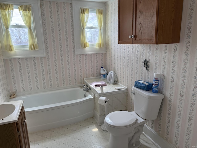 bathroom with a bath, toilet, and tile patterned floors