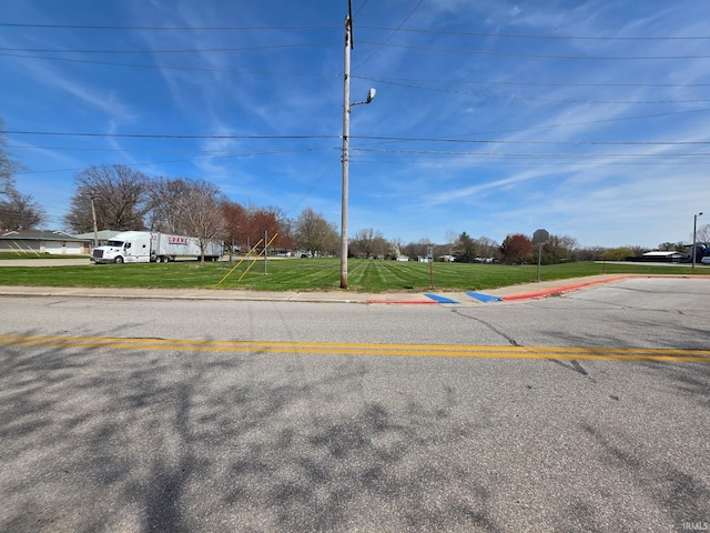 view of road with curbs and sidewalks