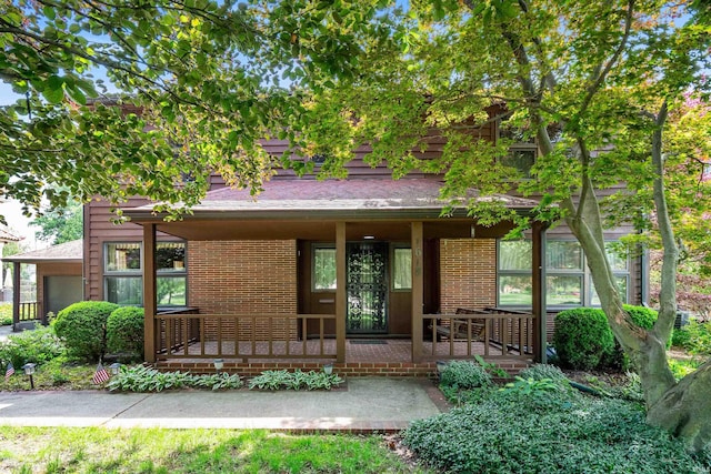 1618 Forest Park Blvd, Fort Wayne, IN 46805 - view of front facade featuring a porch and brick siding