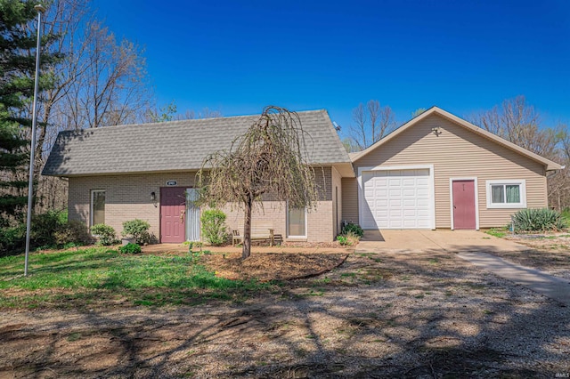 8901 Vienna Rd, Evansville, IN 47720 - single story home with brick siding, driveway, a shingled roof, and a garage