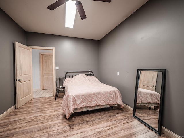 8901 Vienna Rd, Evansville, IN 47720 - bedroom featuring light wood-style flooring, baseboards, and a ceiling fan