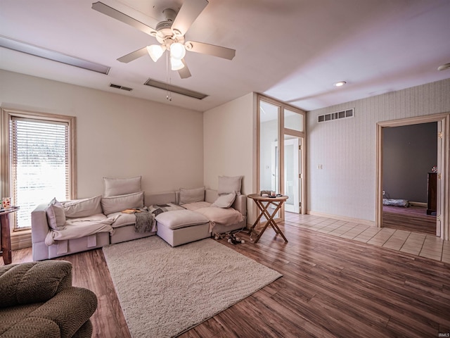 8901 Vienna Rd, Evansville, IN 47720 - living area featuring wood finished floors, visible vents, a ceiling fan, and baseboards