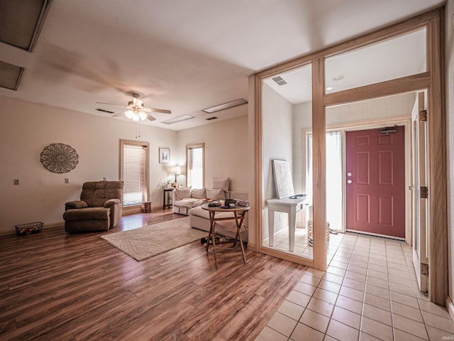 8901 Vienna Rd, Evansville, IN 47720 - foyer featuring baseboards, a ceiling fan, visible vents, and light wood finished floors