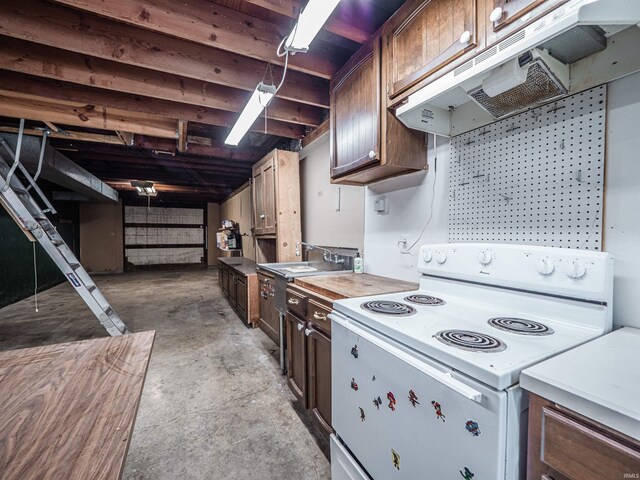 8901 Vienna Rd, Evansville, IN 47720 - kitchen with unfinished concrete flooring, under cabinet range hood, electric stove, and light countertops
