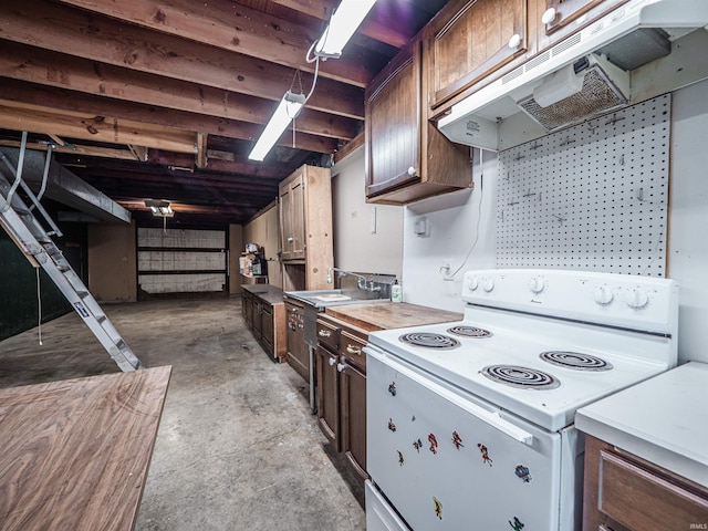 8901 Vienna Rd, Evansville, IN 47720 - kitchen with unfinished concrete flooring, under cabinet range hood, electric stove, and light countertops