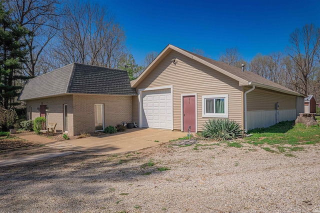 8901 Vienna Rd, Evansville, IN 47720 - exterior space featuring brick siding, driveway, a shingled roof, and an outbuilding